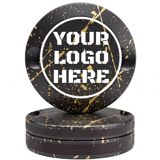 Black and gold paint splatter CNC-machined aluminum nicotine pouch tin with custom YOUR LOGO HERE laser engraving placeholder in white circle on lid with knurled sides on white background